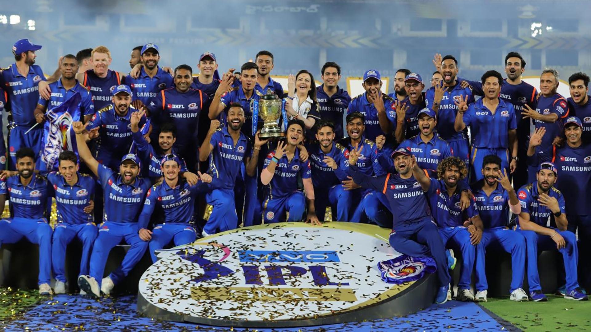 Mumbai Indians with the IPL trophy in 2019 | Number of matches each team needs to win to qualify for playoffs | IPL 2021 | SportzPoint.com